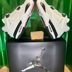 Jordan Men's White and Black Sneakers with Red details. Ideal for casual wear.